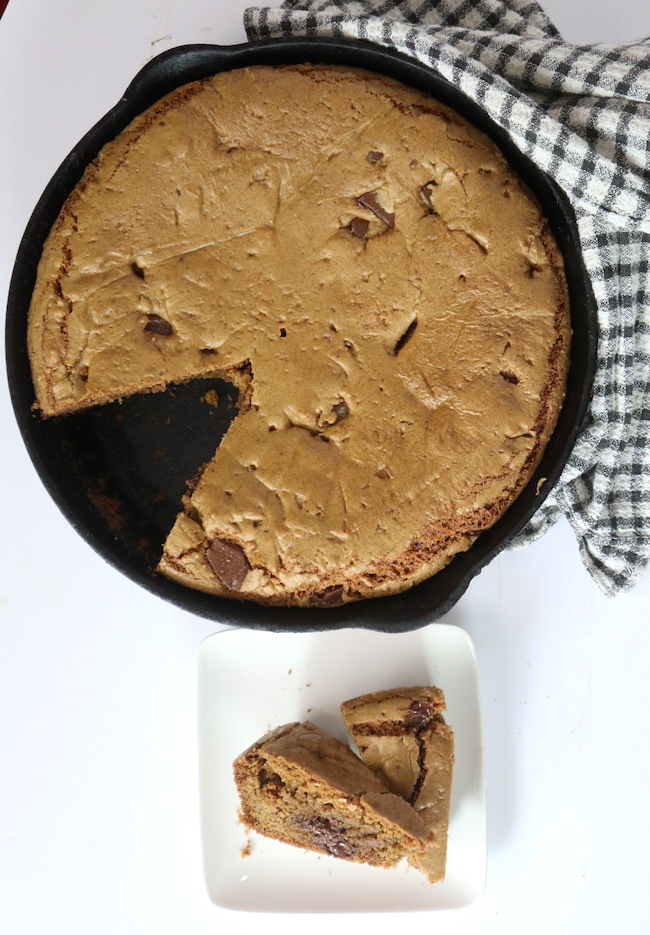Flourist Chocolate Chip Cookie baked in a large cast iron sklllet